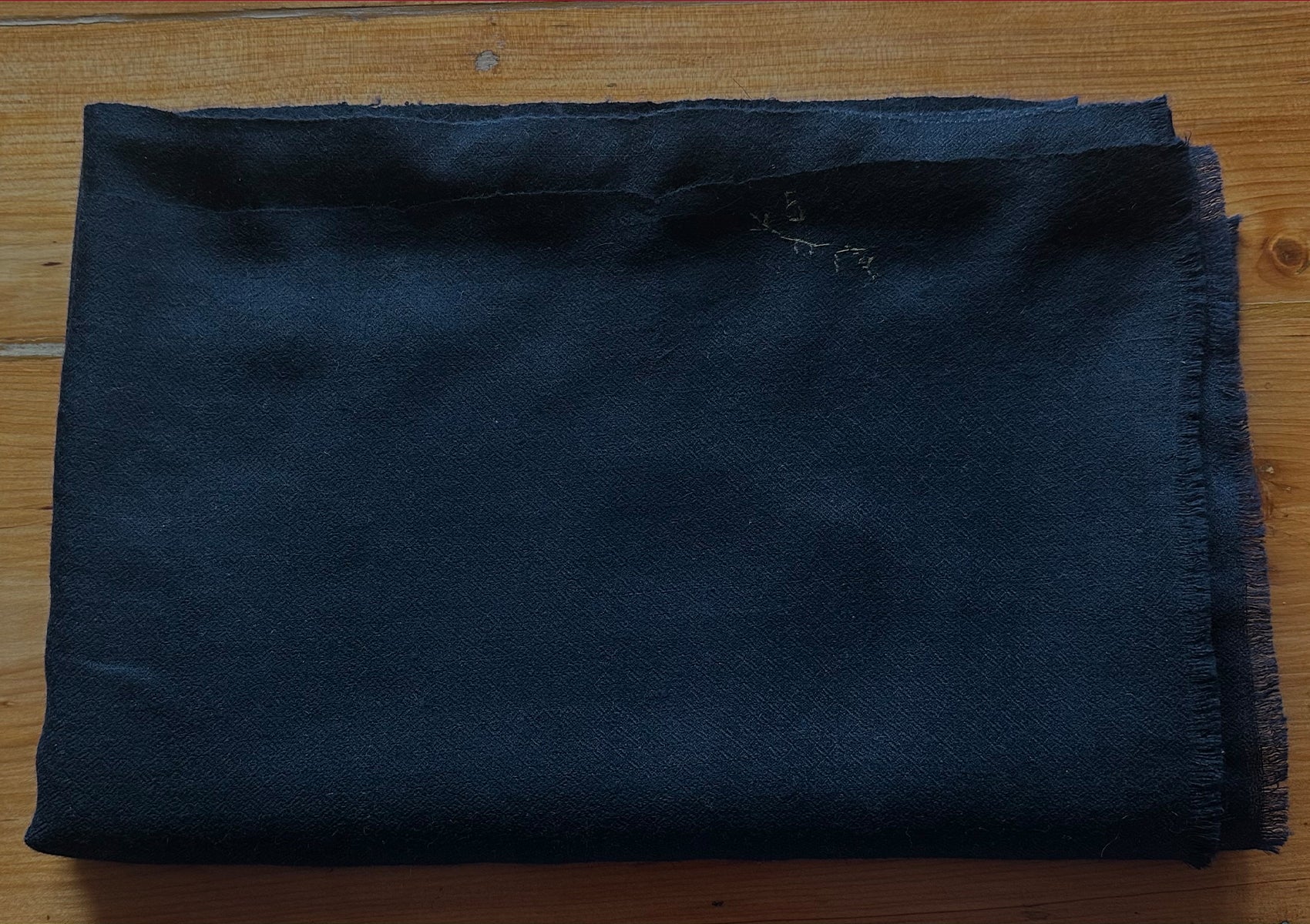 Folded BODHI midnight-blue shawl in 100% authentic pashmina, handwoven in Kashmir.