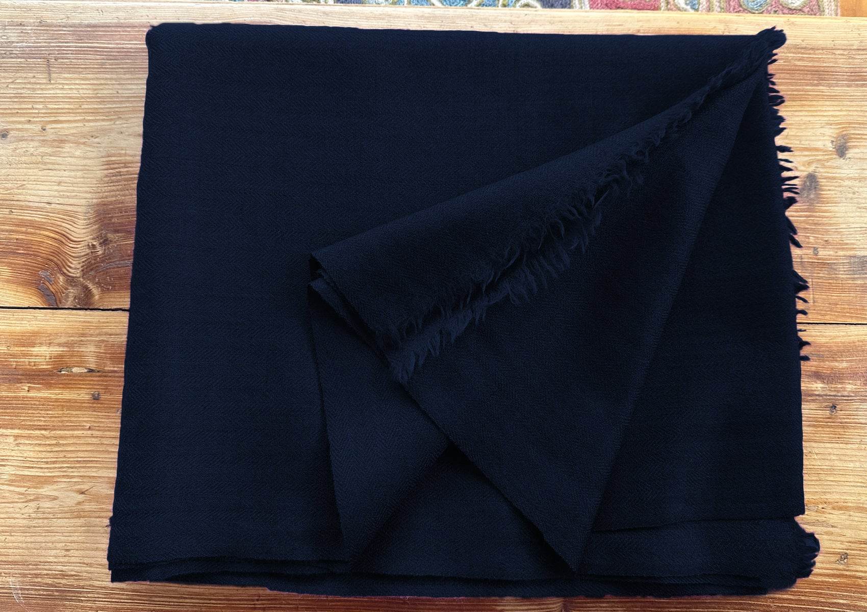 Folded dark navy Lama large meditation blanket with fine twill weave.