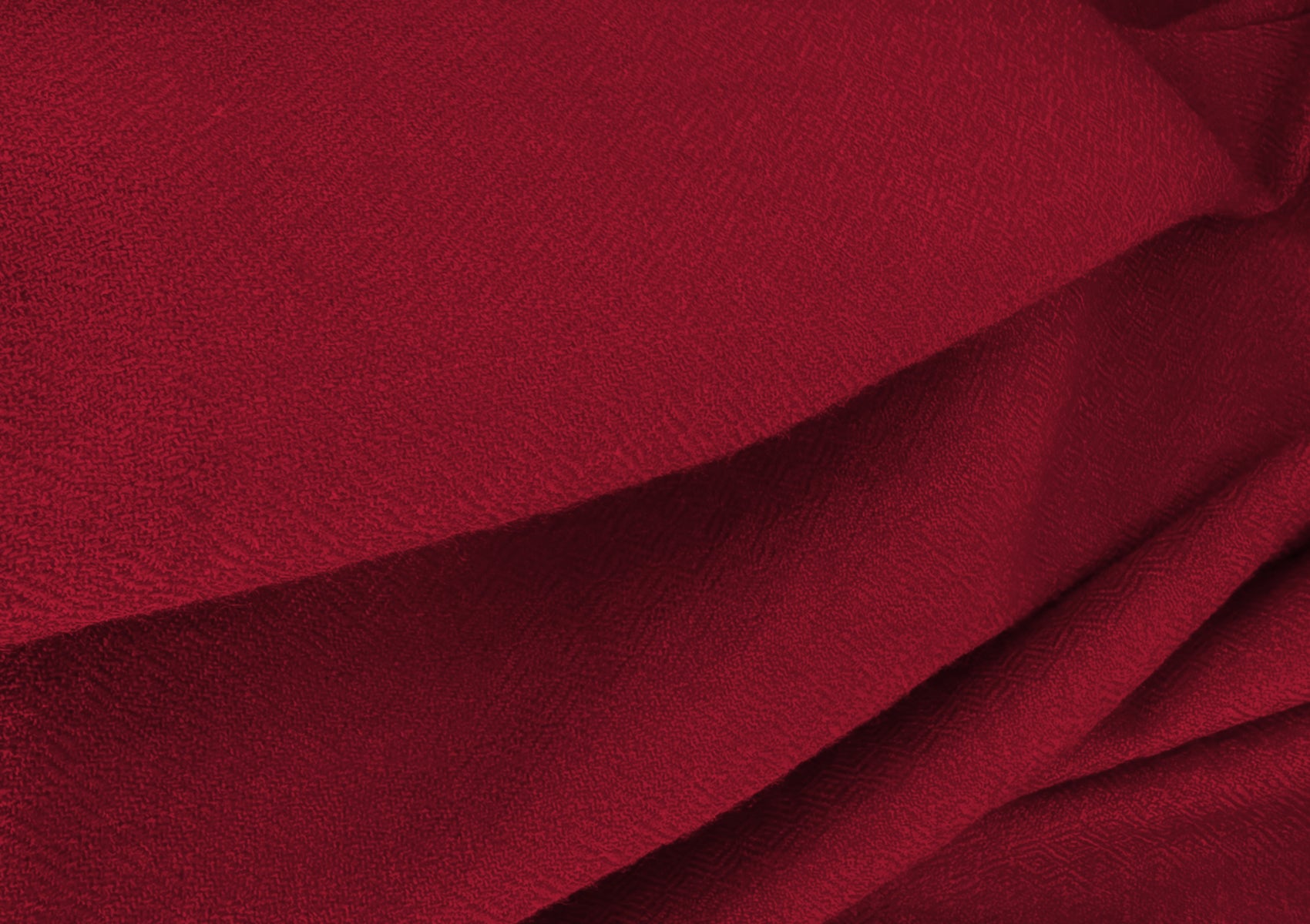 Detailed close-up of the diamond weave pattern of the LAMA burgundy lama shawl, handwoven in the Himalayas.
