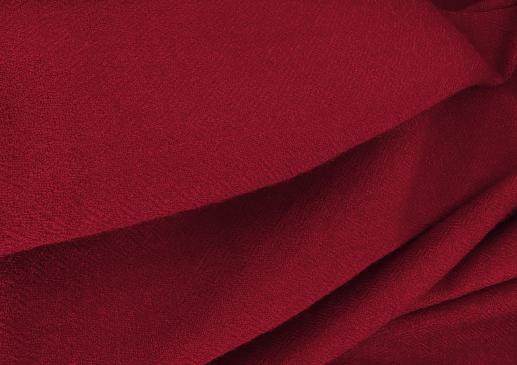 Detailed close-up of the diamond weave pattern of the LAMA burgundy lama shawl, handwoven in the Himalayas.
