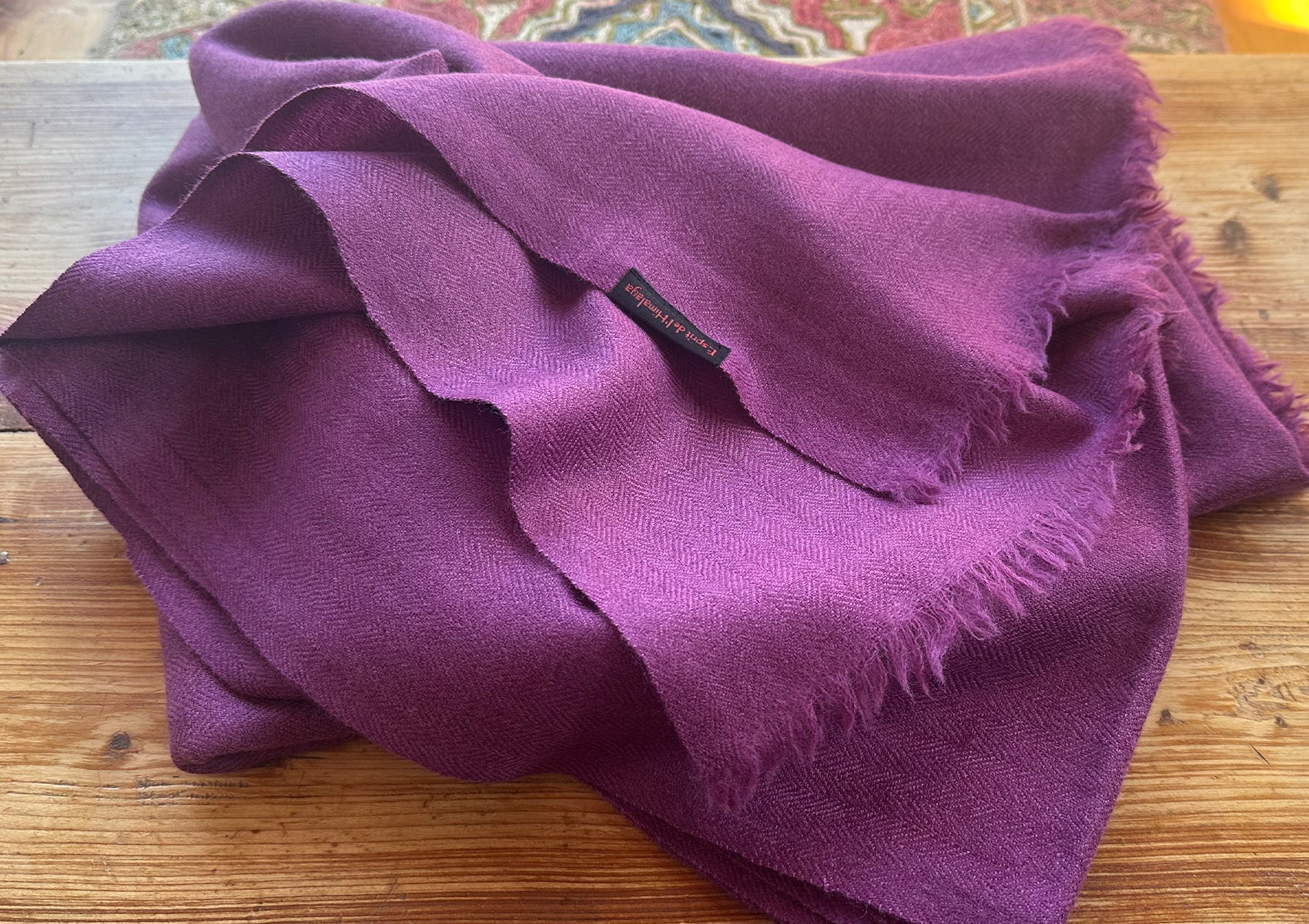 Prayer shawl in light purple worn for meditation in the Himalayas.