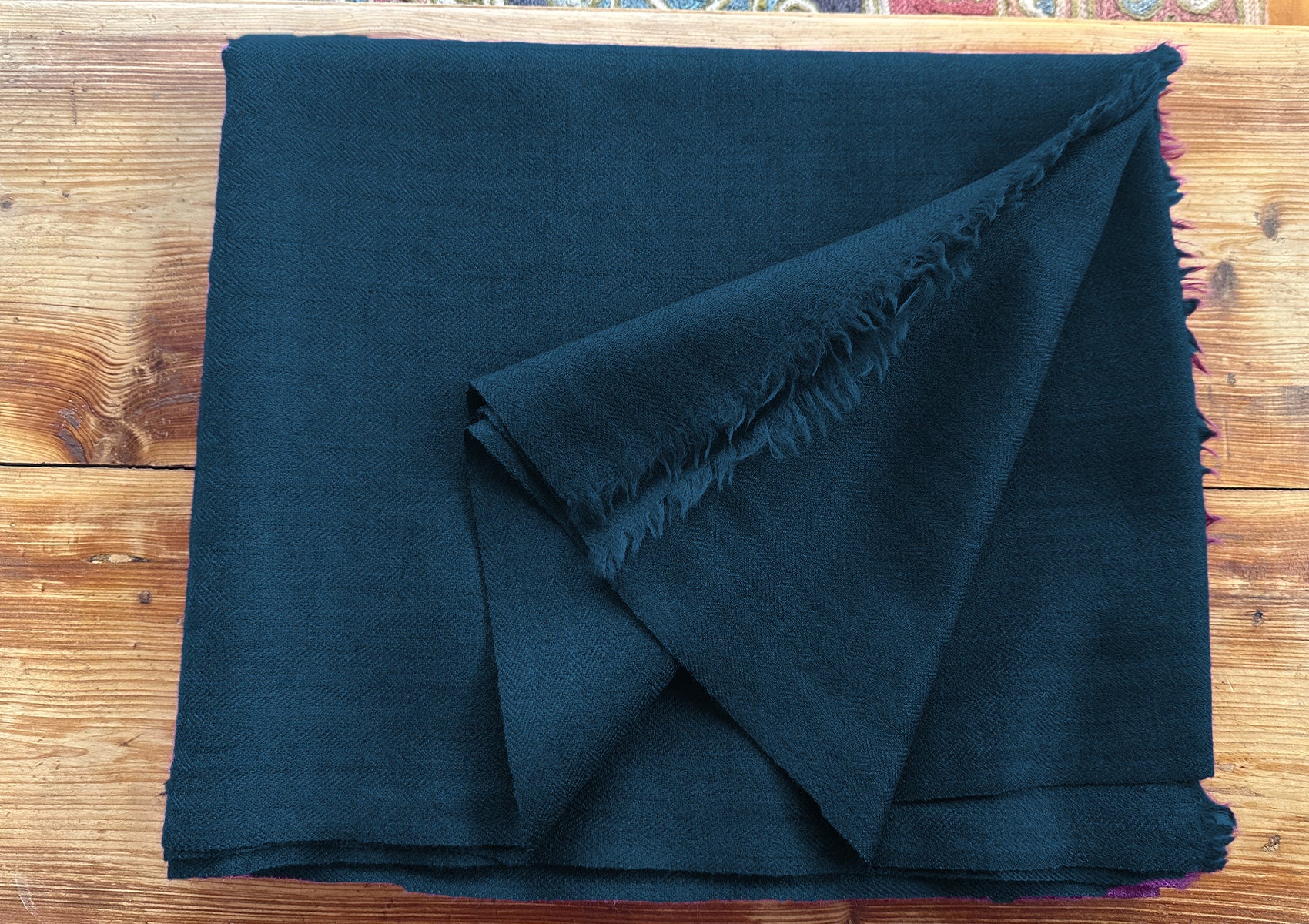 Folded LAMA steel blue meditation shawl in herringbone weave.