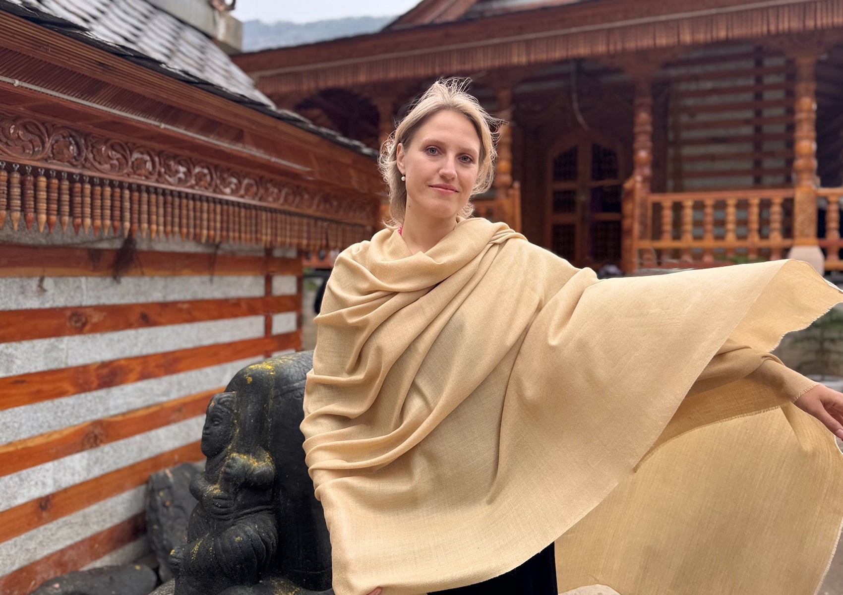 Large beige merino wool shawl displayed flat to show its generous size and soft weave