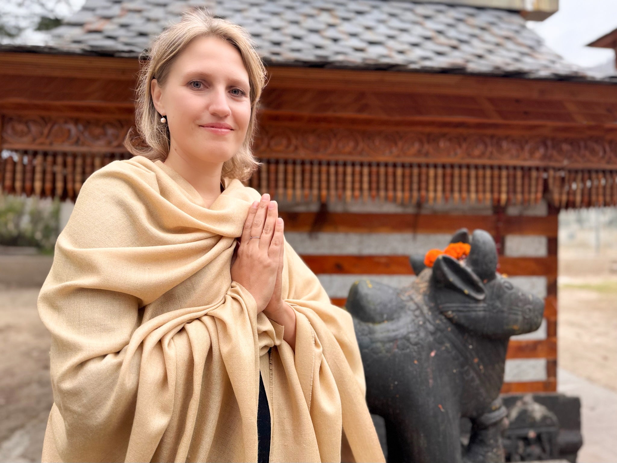 Fine beige merino wool shawl folded neatly – softness and luxury for meditation