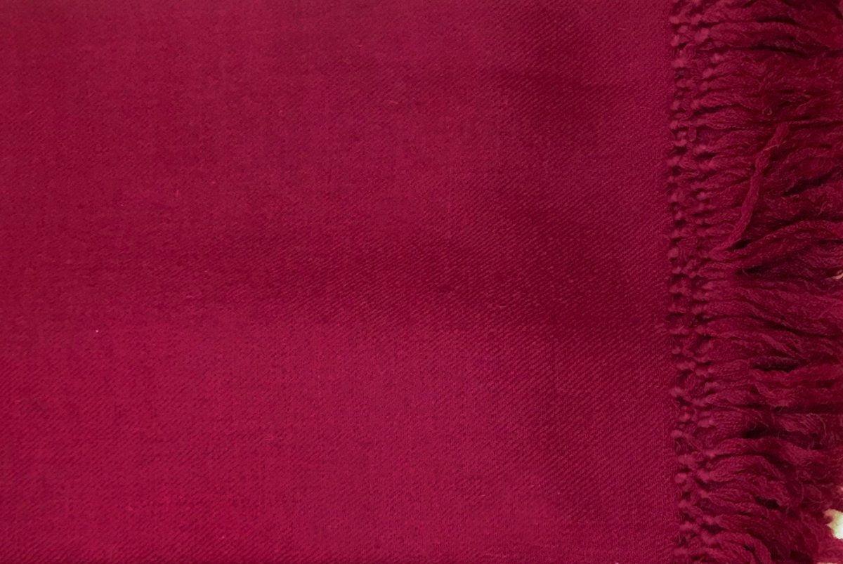 Burgundy large Buddhist shawl shown from a close angle, displaying its intricate weave and rich color, perfect for meditation sessions.